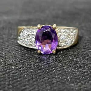 Large ring with a large purple gem